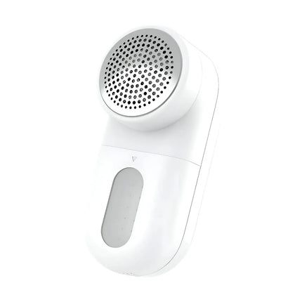 A white handheld lint remover or fabric shaver with a circular perforated metal head and a translucent storage window, shown on a plain white background. peetta-best online store uae